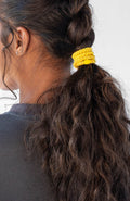 Thick yellow hair ties for curly hair.