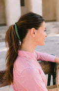 French woman sitting on bench wearing an L. Erickson Zodia, Matte Mint Green Banana Hair Clip with Double Rows of Teeth for Secure Hold