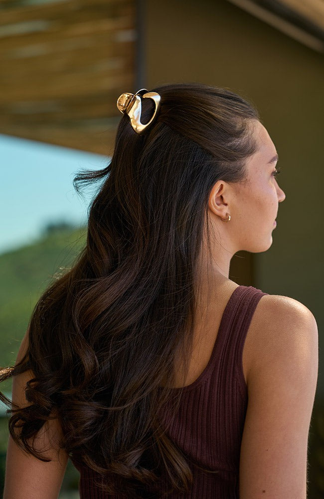 Gold hair clip, modern cutout design. L. Erickson hair claw for medium to thick hair