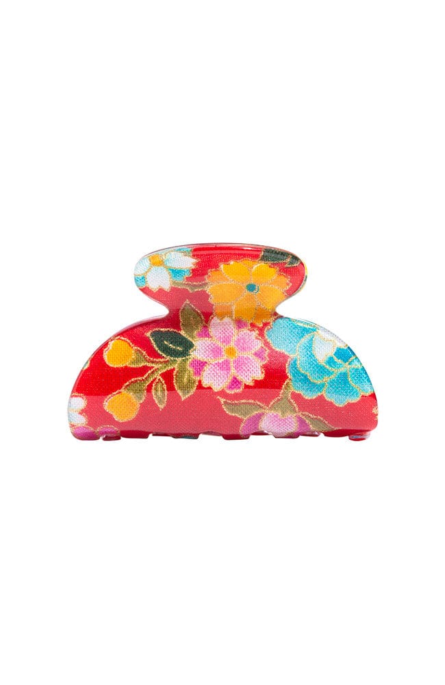 Little claw hair clip with floral and red acetate laminate and spring closure, by France Luxe, front view