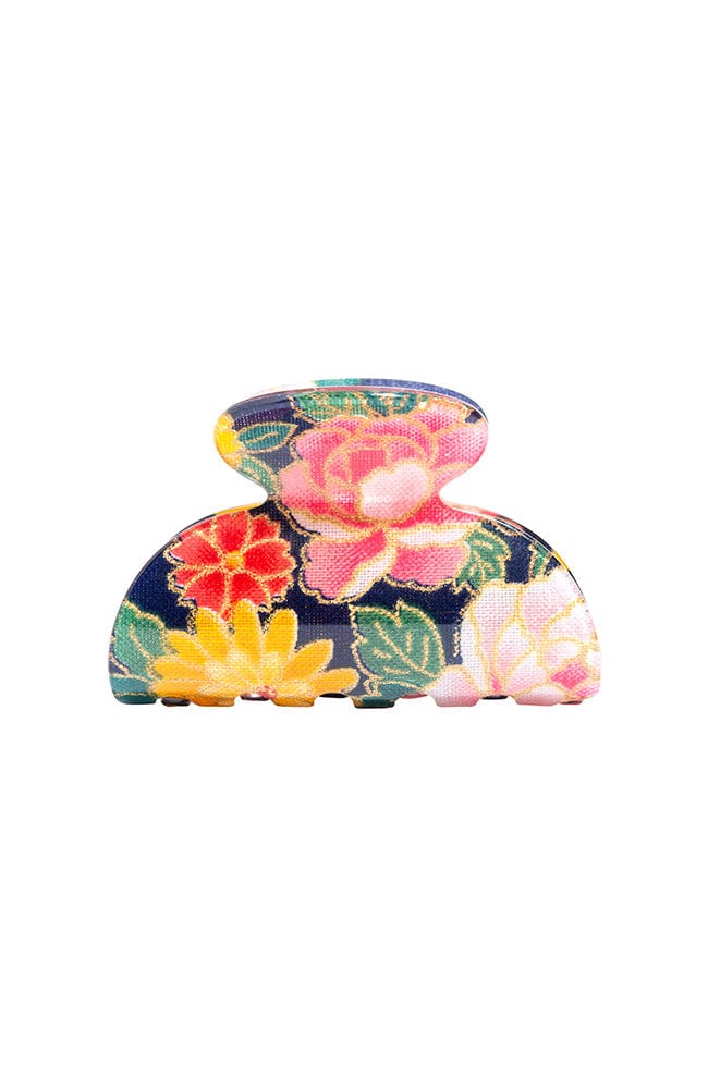 Little claw hair clip with floral and navy blue acetate laminate and spring closure, by France Luxe, front view