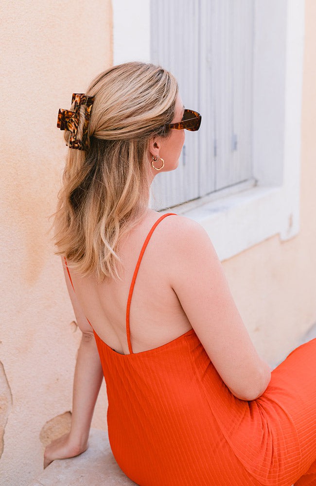 luxurious large claw hair clip holding top half of hair at the back of the head